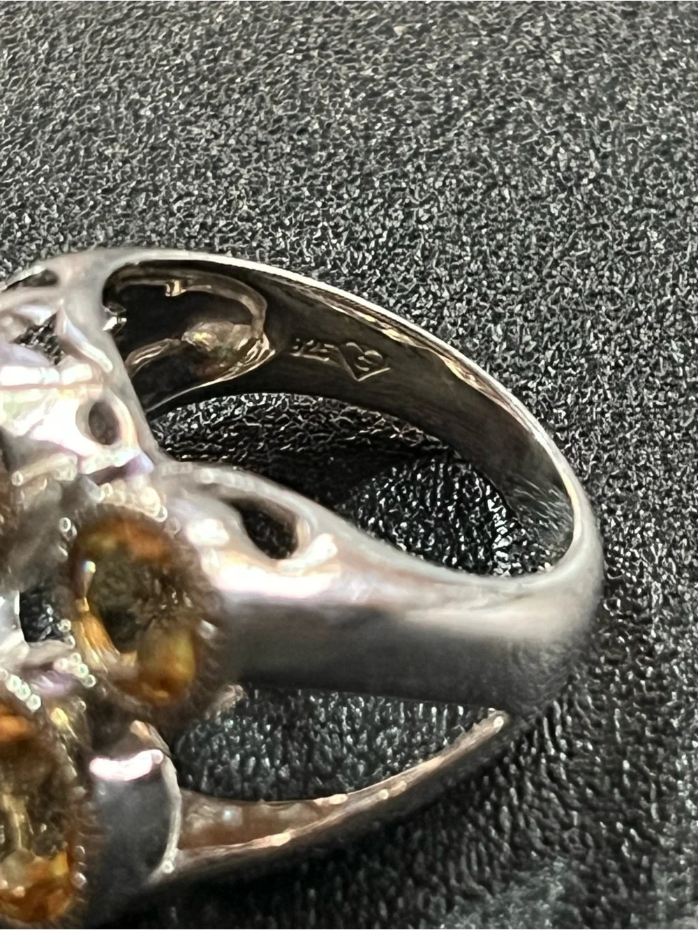 Sterling silver ring w/ 4 citrine gemstones. Sz 7. Pretty, unique design. 925